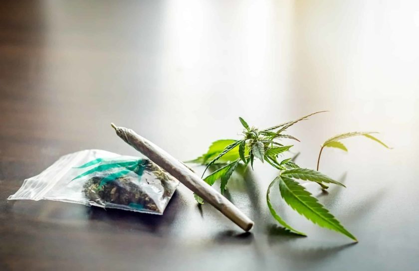 Joint and weed in plastic bag medical or recreational marijuana